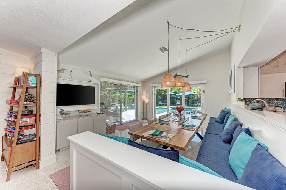 One More Day looking at the dining room towards the back of the house through the two sliding glass door