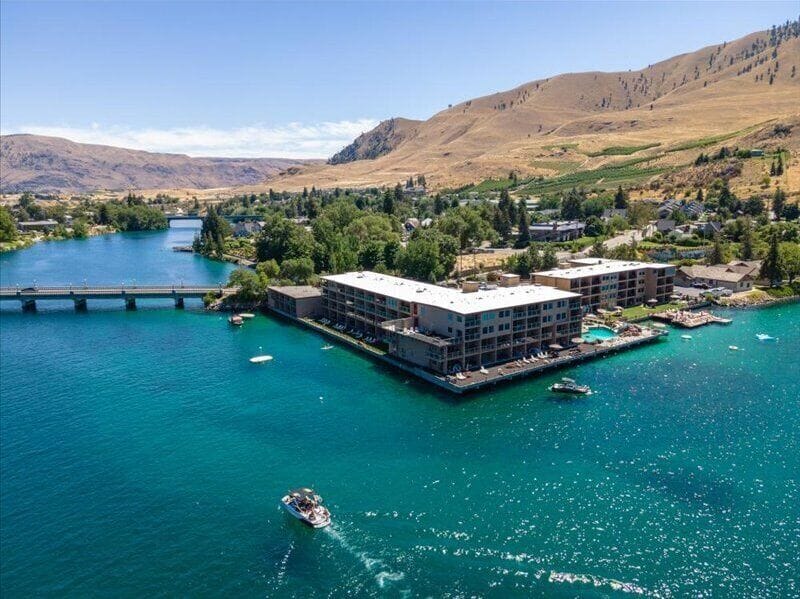 Stunning lakefront property nestled between rolling hills and pristine waters, offering a peaceful retreat in nature's embrace.