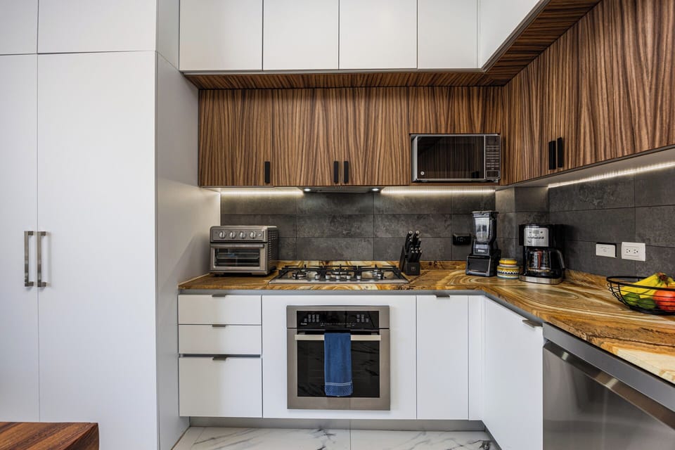 Sleek Kitchen — Fully-equipped with top-of-the-line appliances
