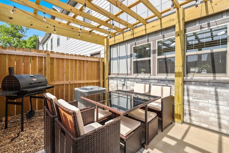 Hang with your crew in our furnished back yard, complete with a charcoal grill, outdoor dining, and string lights.