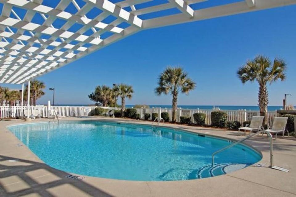 Relax in the lounge chairs while the kids splash in the pool.