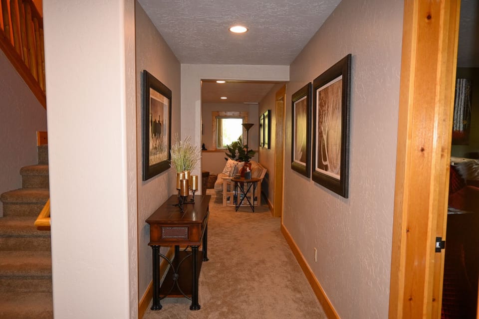 Stairway/hallway to lower living room.