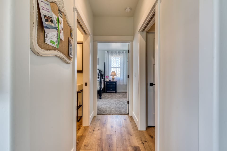 Hallway to Master Bedroom - powder room on left, laundry on right