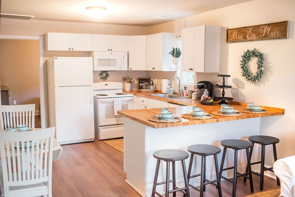 Kitchen with bar and eat-in dining. 