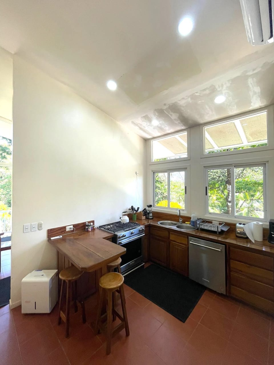 KITCHEN - With high ceilings, windows and great appliances and cookware...