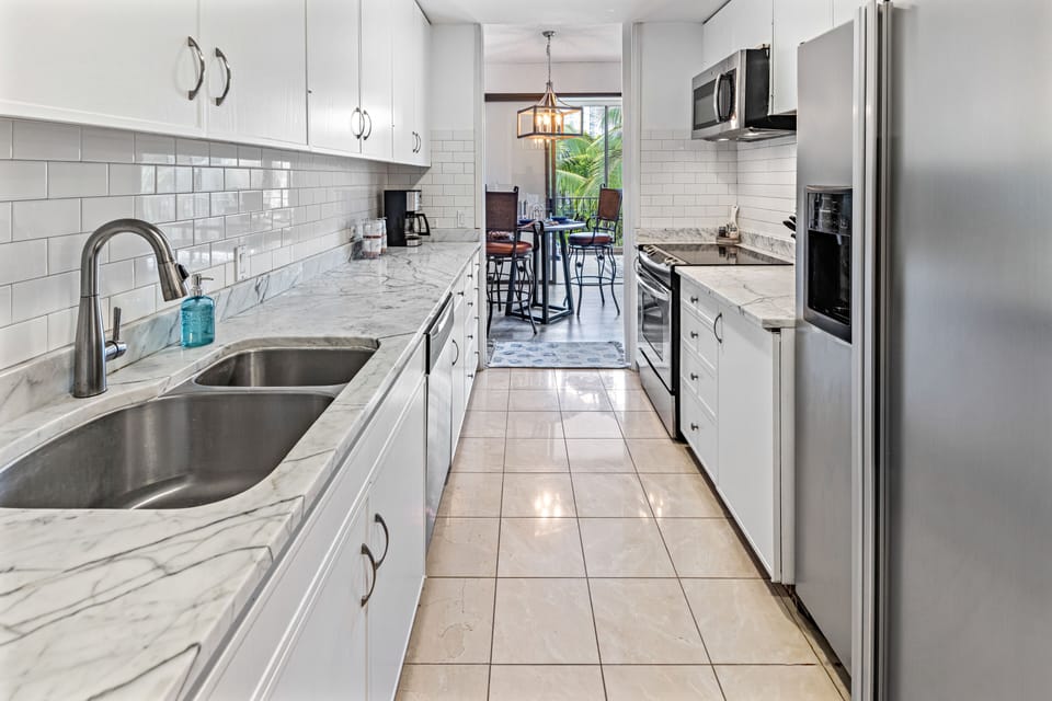 Modern clean finishes, with marble countertops.