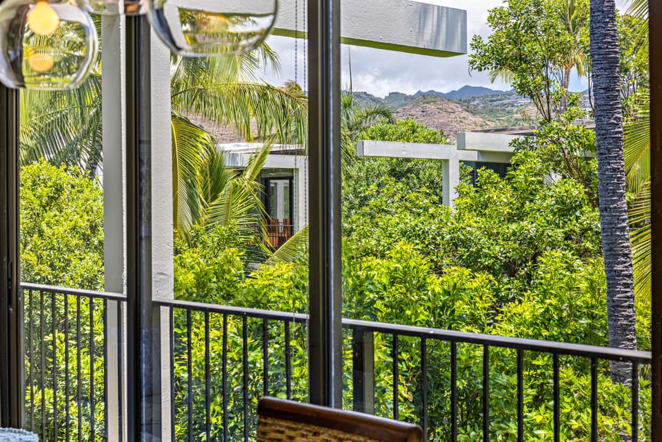 The mountains are viewed in one direction, and a peek of the ocean in the other.