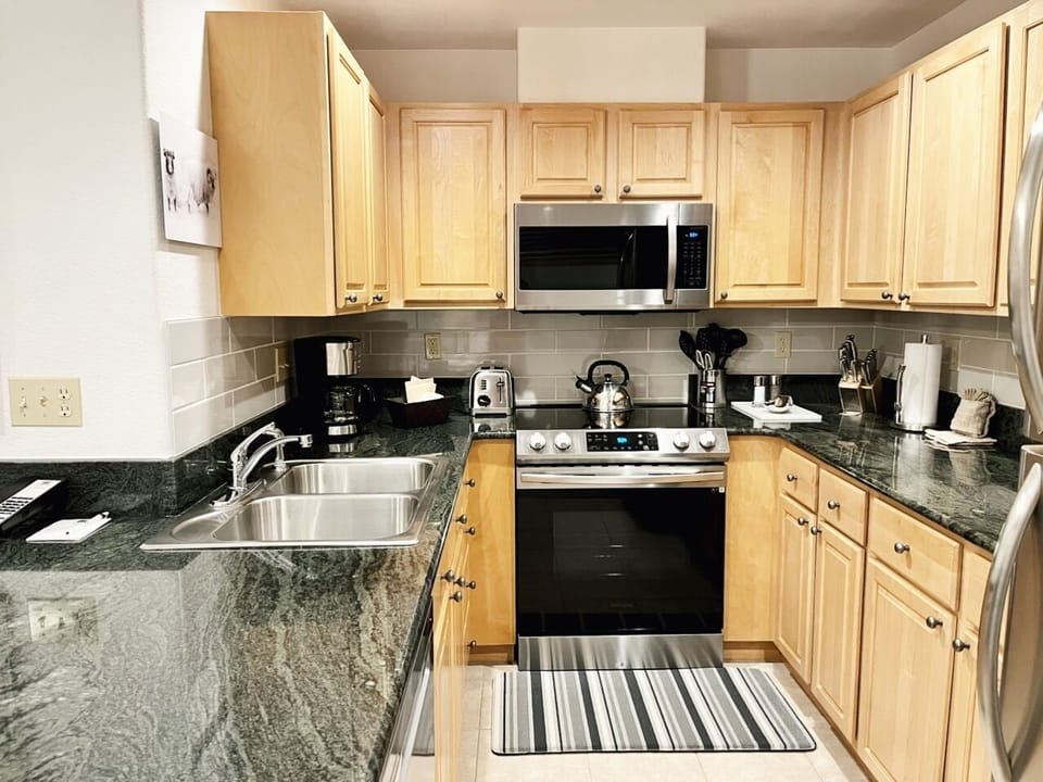 Fully Stocked Kitchen with new Stainless Steel appliances and backsplash
