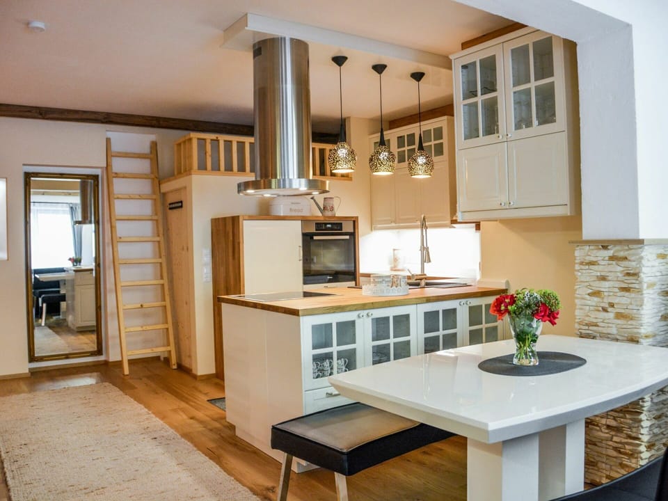 Cabinetry, Countertop, Furniture, Table, Kitchen, Building, Kitchen Stove, Home Appliance, Wood, Living Room