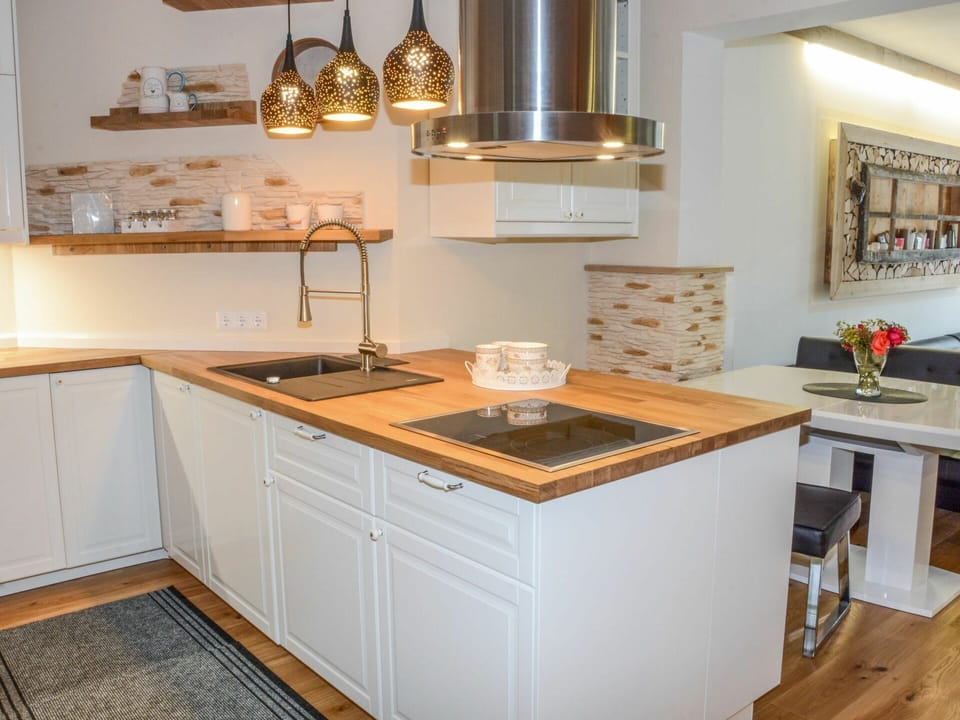Countertop, Cabinetry, Property, Furniture, Kitchen Stove, Kitchen, Picture Frame, Wood, Lighting, Kitchen Appliance
