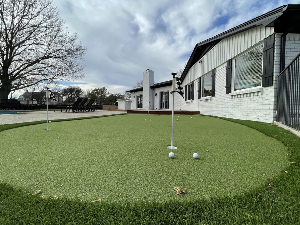 4 hole putting green with putters and balls 
Kid and adult clubs