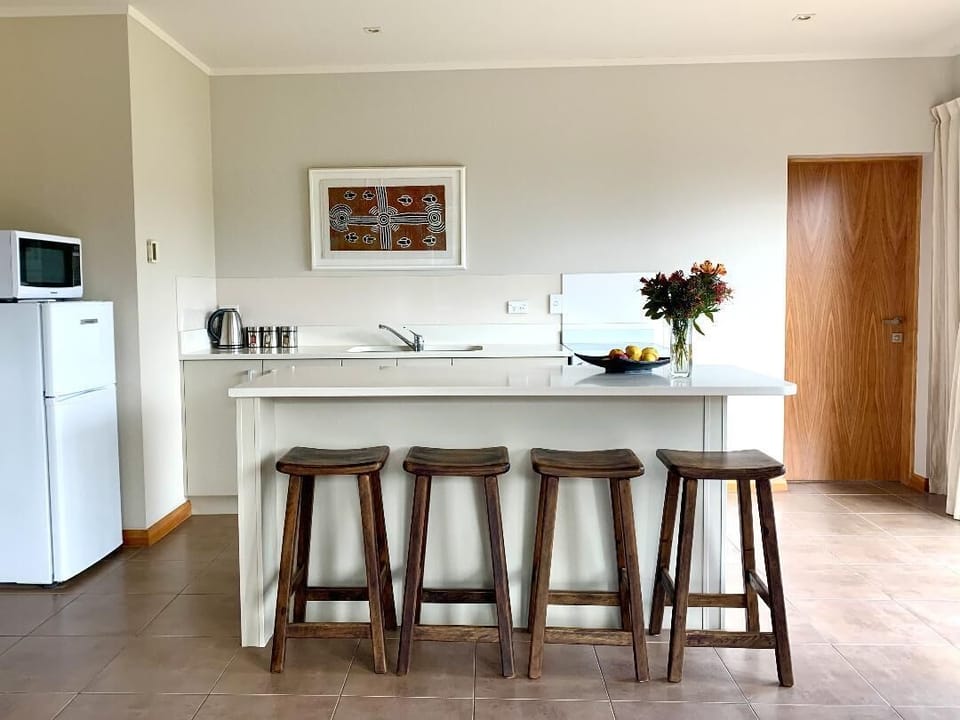 Kitchen with central island, perfect for informal dining and socialising