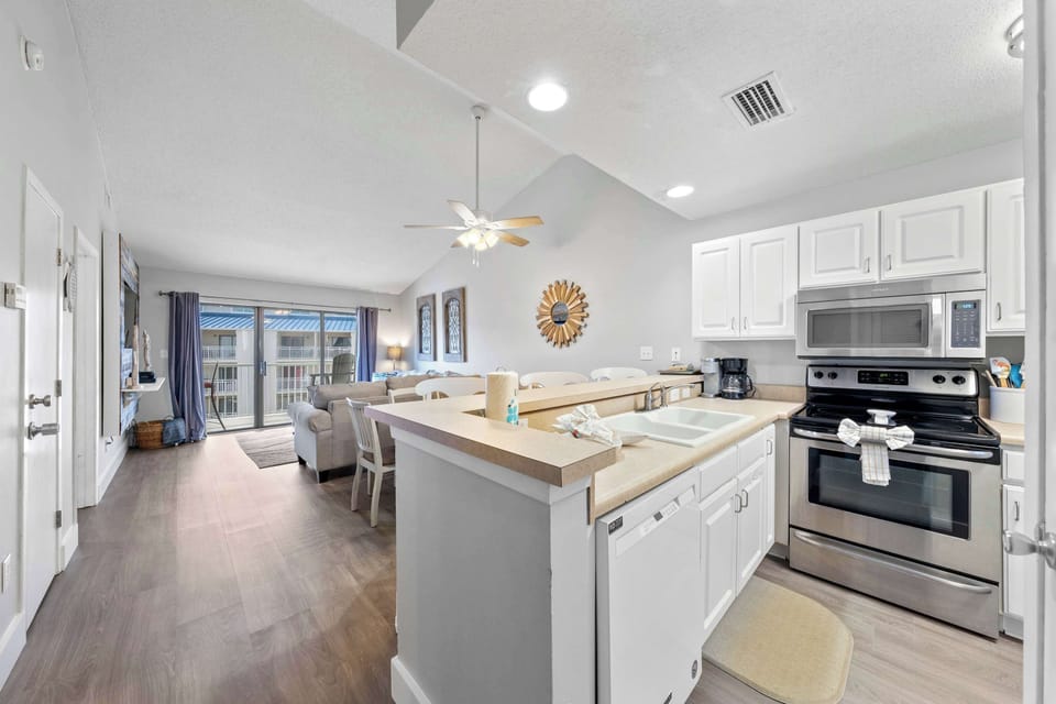 Kitchen opens into living area