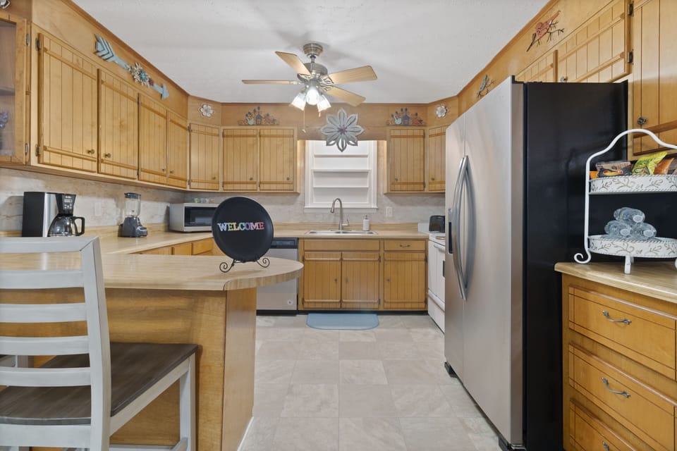 Kitchen with microwave, oven, drip coffee maker, toaster, blender, dishwasher