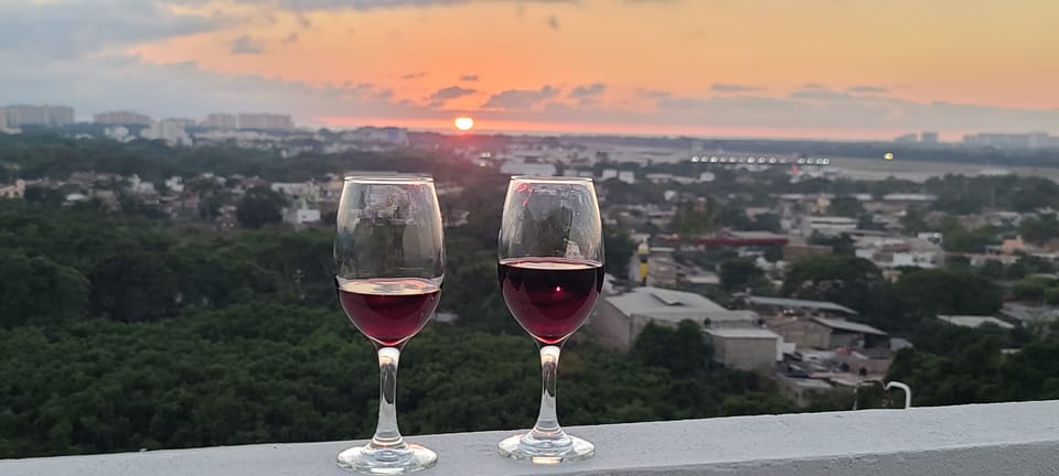 Rooftop view of the sunset.  Great area to have some drinks.
