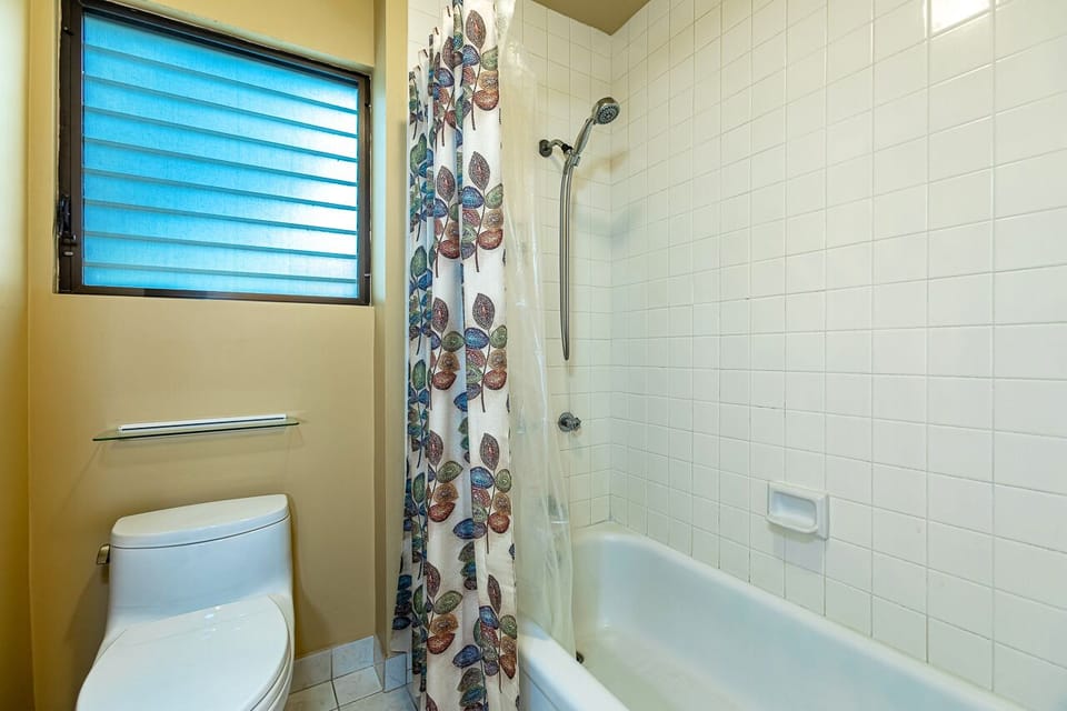 Guest bathroom with a shower and tub