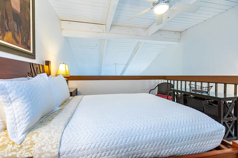 Guest bedroom features a queen bed 