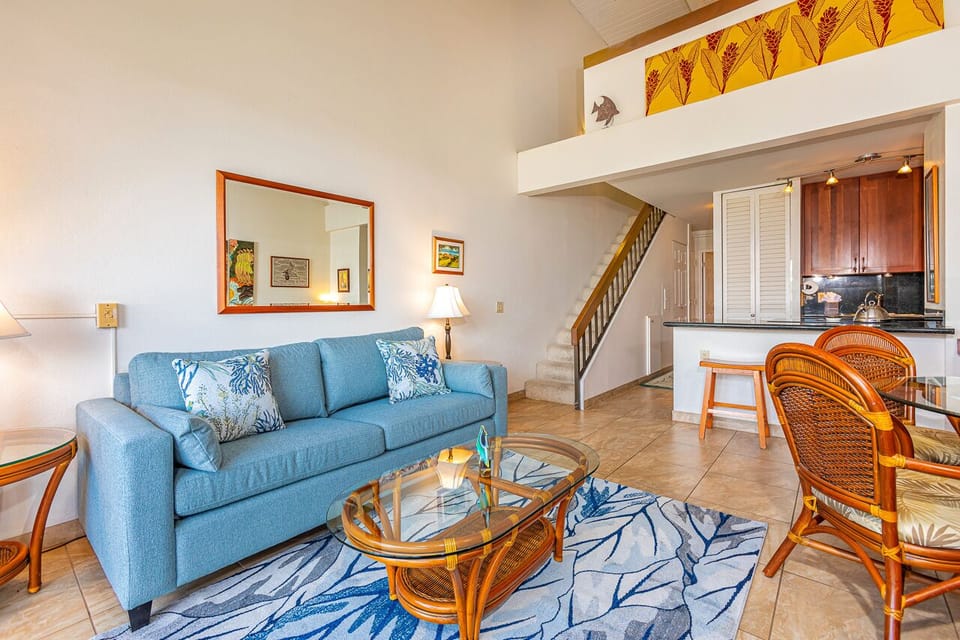 Living room features a sleeper sofa 