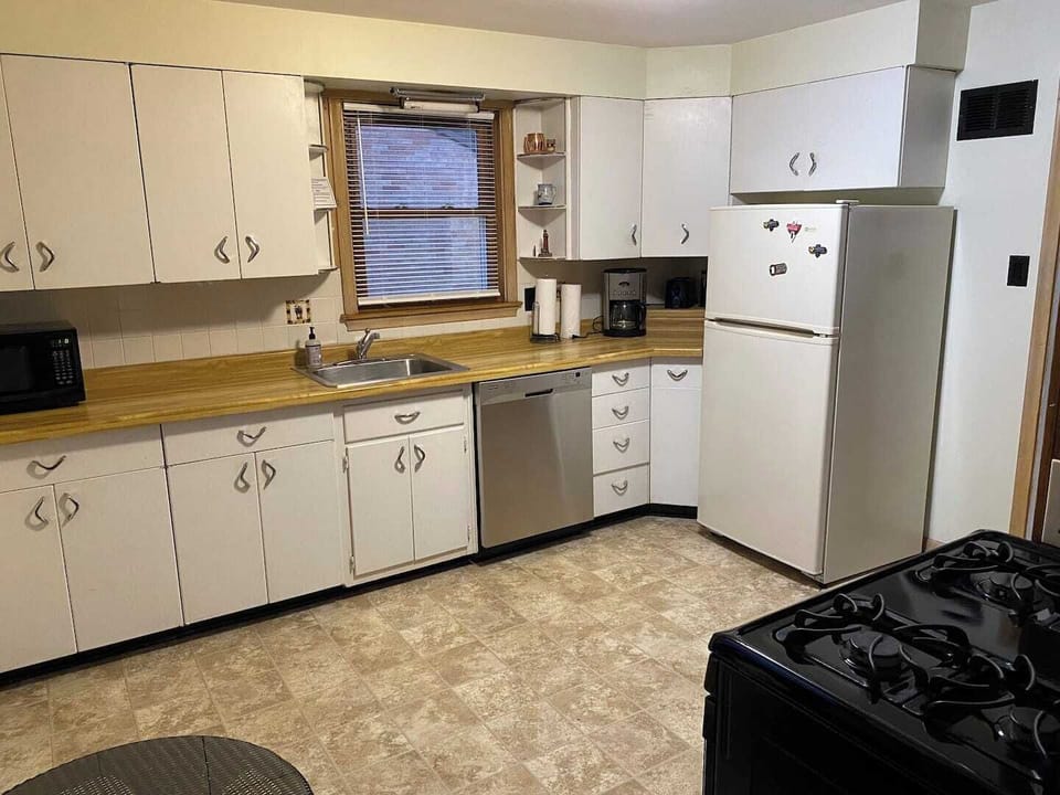 Full sized refrigerator, dish washer and counter space. 