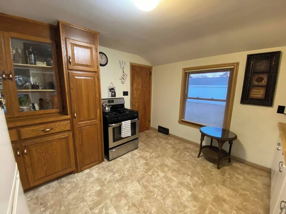 Full sized stove and basement entry door. 