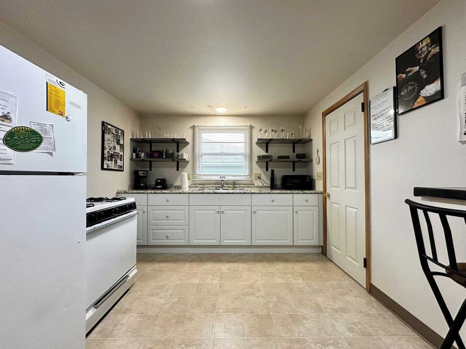 Full kitchen with full stove and refrigerator 