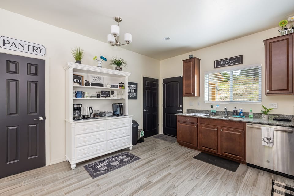 Coffee station, pantry and well equipped kitchen