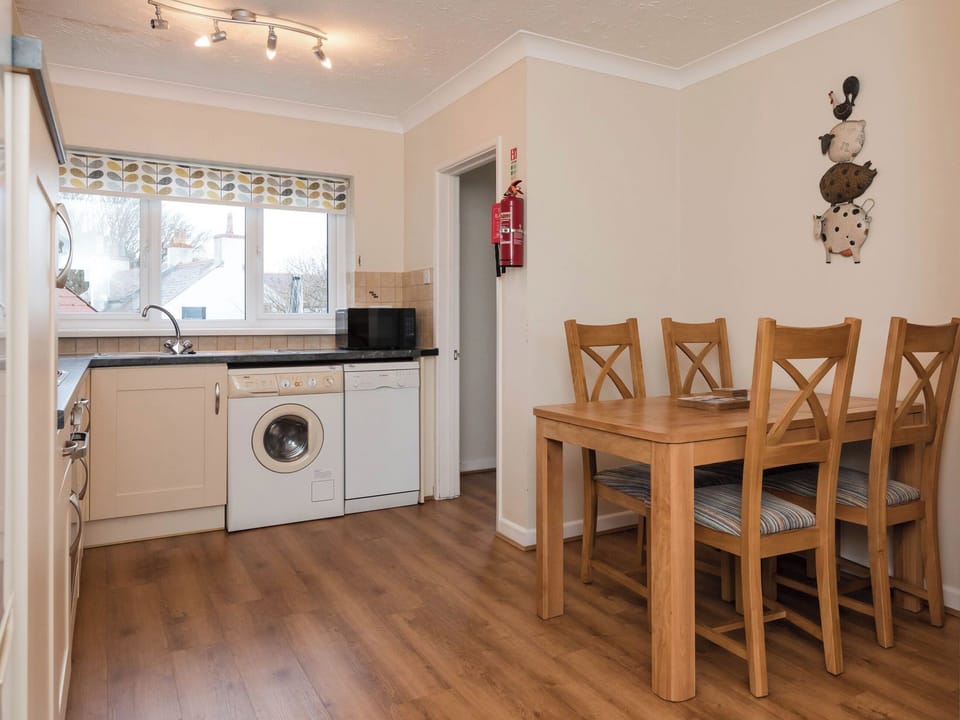 Kitchen/diner | Dolphin Cottage - Celtic Haven Resort, Lydstep, near Tenby