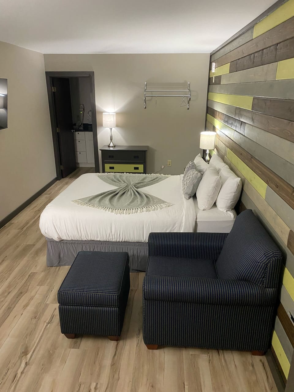 Queen bed and soft seating