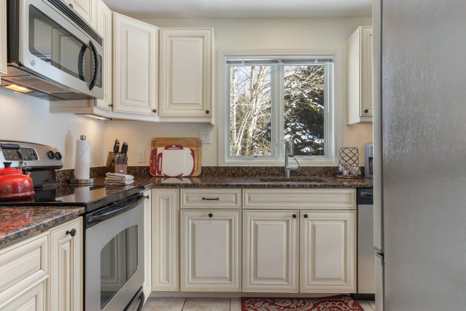 Kitchen is stocked with a Tea Kettle, Knife Block, Crock Pot, Blender, Toaster and Hand Mixer.