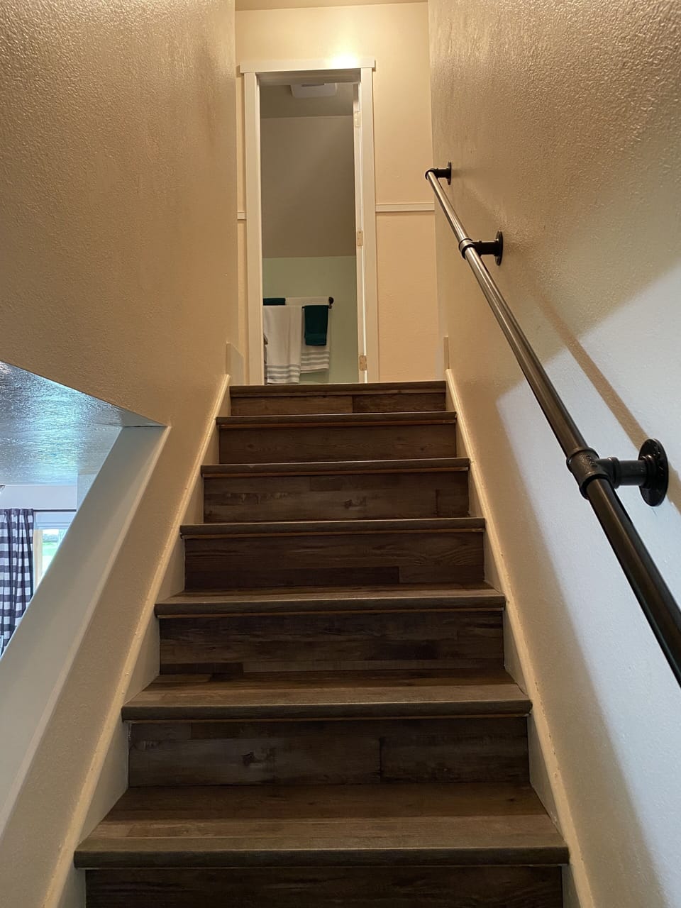 Stairs with full bath at the top