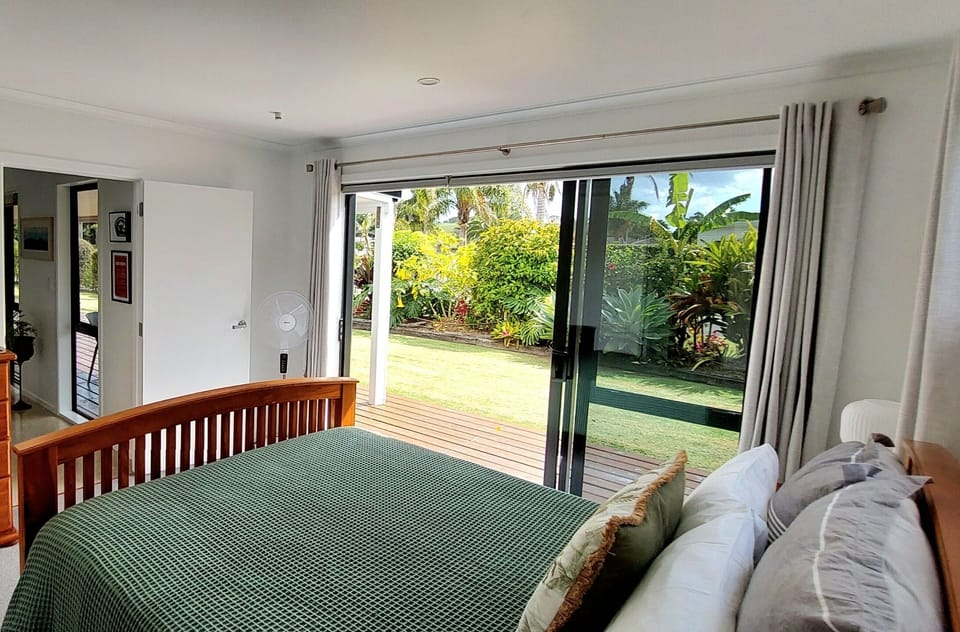 Master bedroom, opens out onto a deck and garden