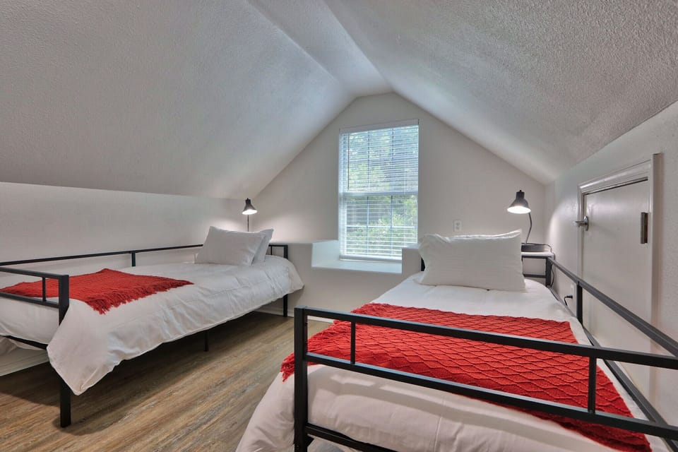 Upstairs game room with two twin beds