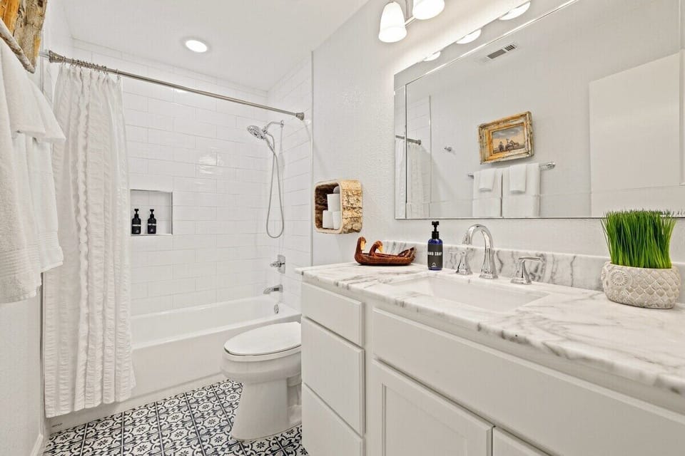 NEWLY RENOVATED! Our second full bathroom features a shower + tub combo and a spacious vanity.