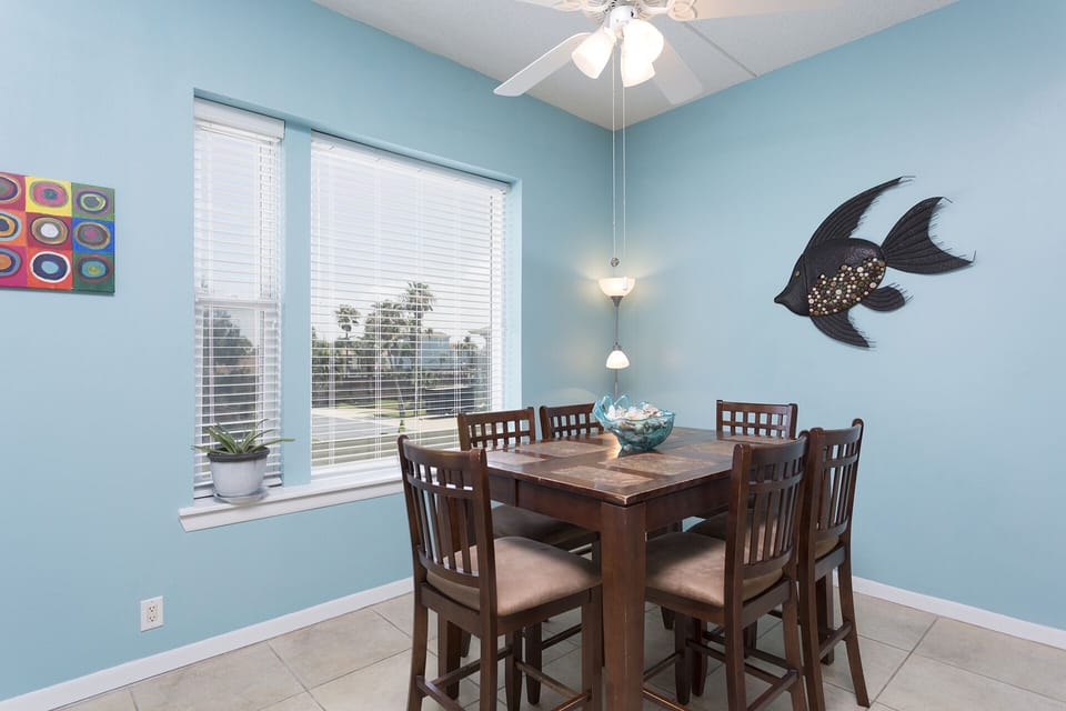 Gather around the dining table while enjoying views of the waterfront.