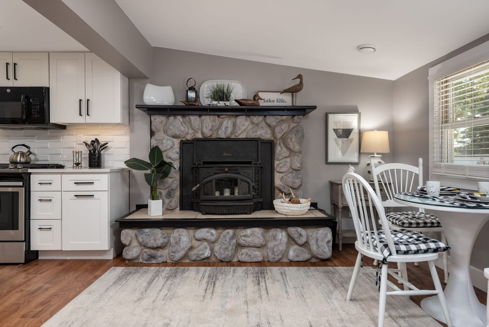 Fireplace adds a warm feeling to the eat in kitchen. Non function in summer.