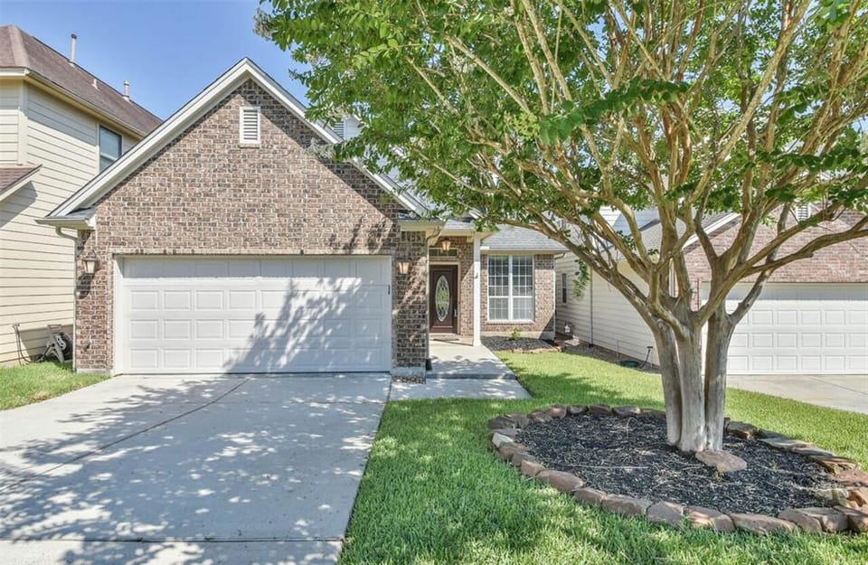 Front yard with parking in driveway.  3 outdoor lights & solar pathway lights