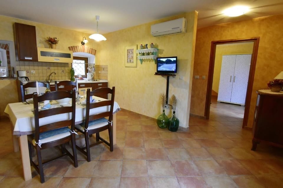The living area with air conditioner, satellite TV, access to the bedroom.
