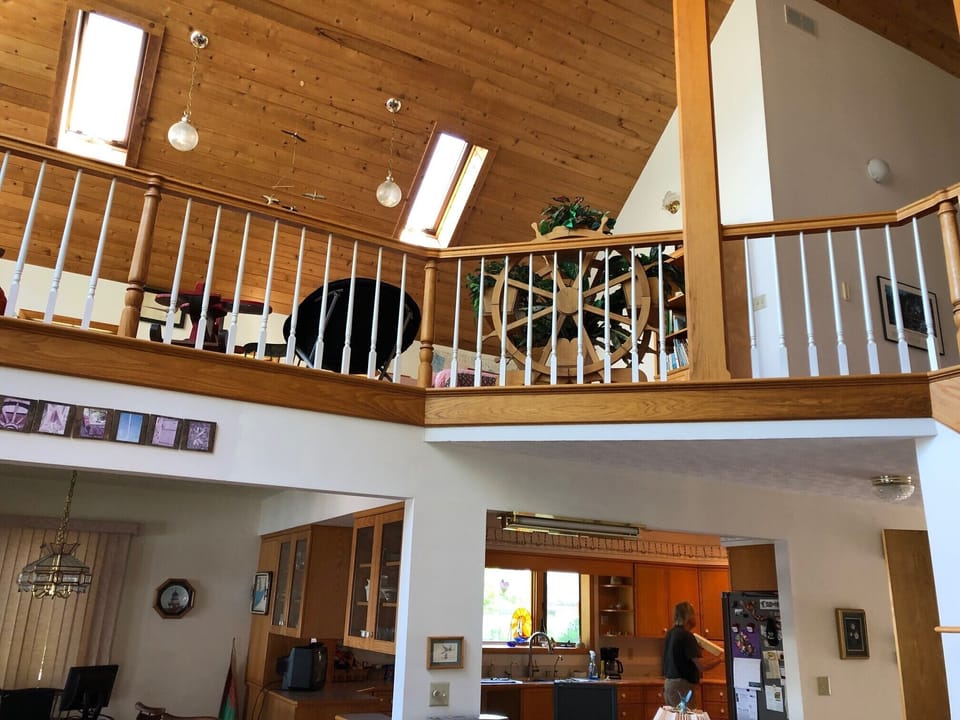 Looking up from family room to loft