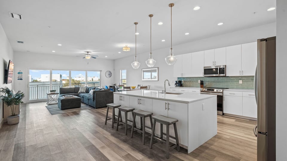 Oversized quartz countertops, 10-foot ceilings, and open concept beach vibes