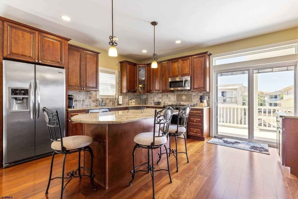 Beautiful gourmet kitchen full sized fridge and wine fridge