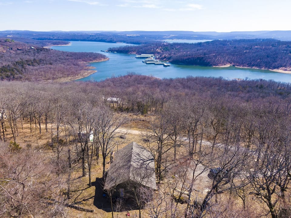 Drone view of house and lake