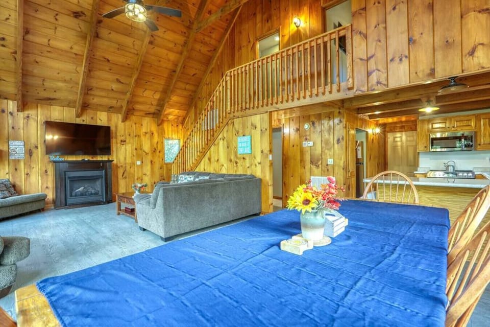 Enjoy the cozy warmth of natural pine in the cabin`s open great room