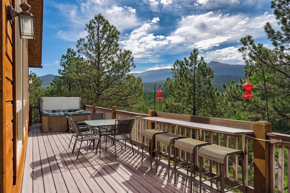 Deck and hot tub looking up at Pikes Peak