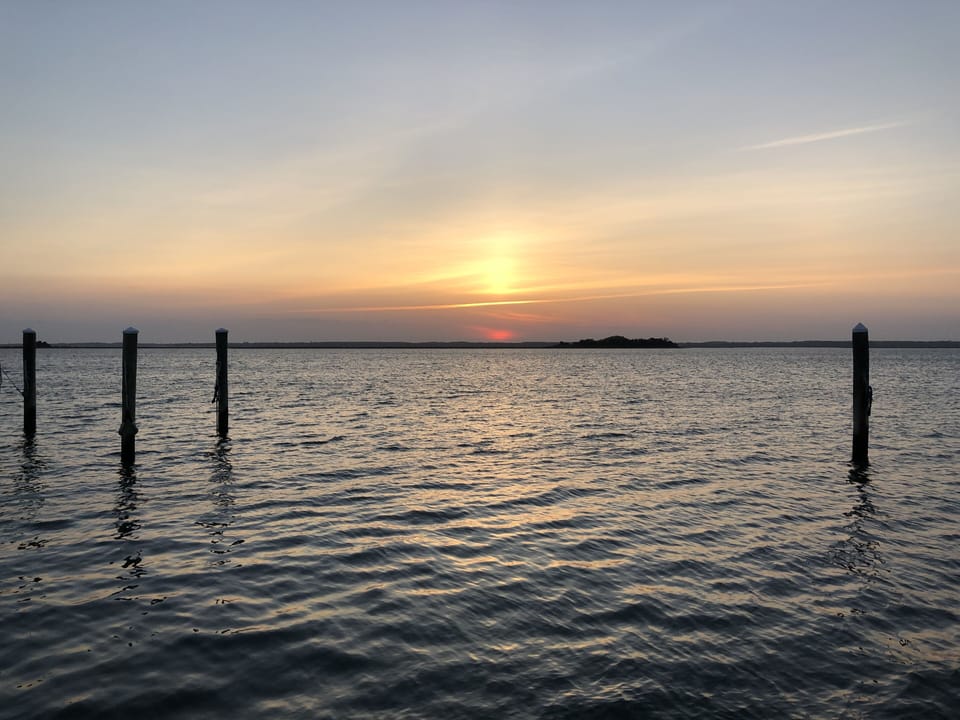 Take a walk across to the bay for a beautiful sunset
