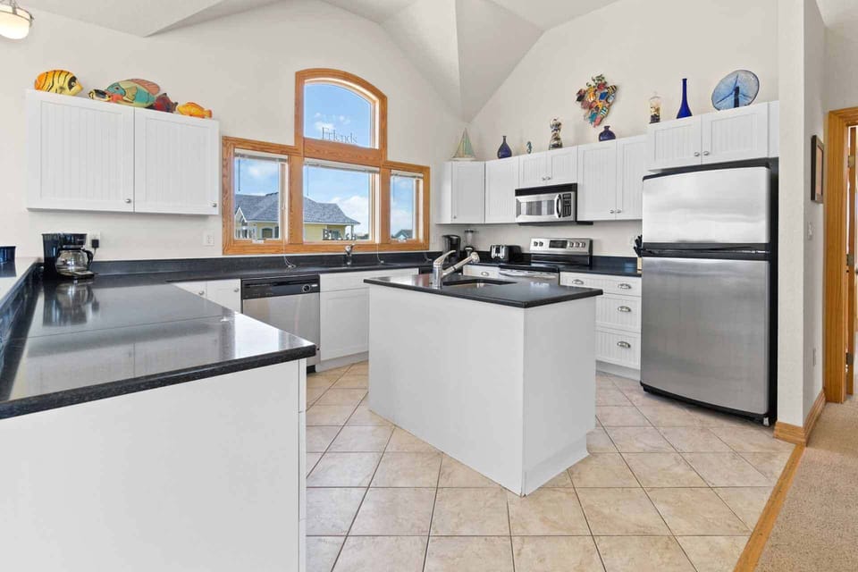 Bright kitchen with a chef's island for effortless cooking.