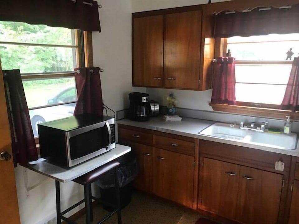 Kitchen stocked w/ dishes, utensils, pots & pans - plus charcoal grill outside