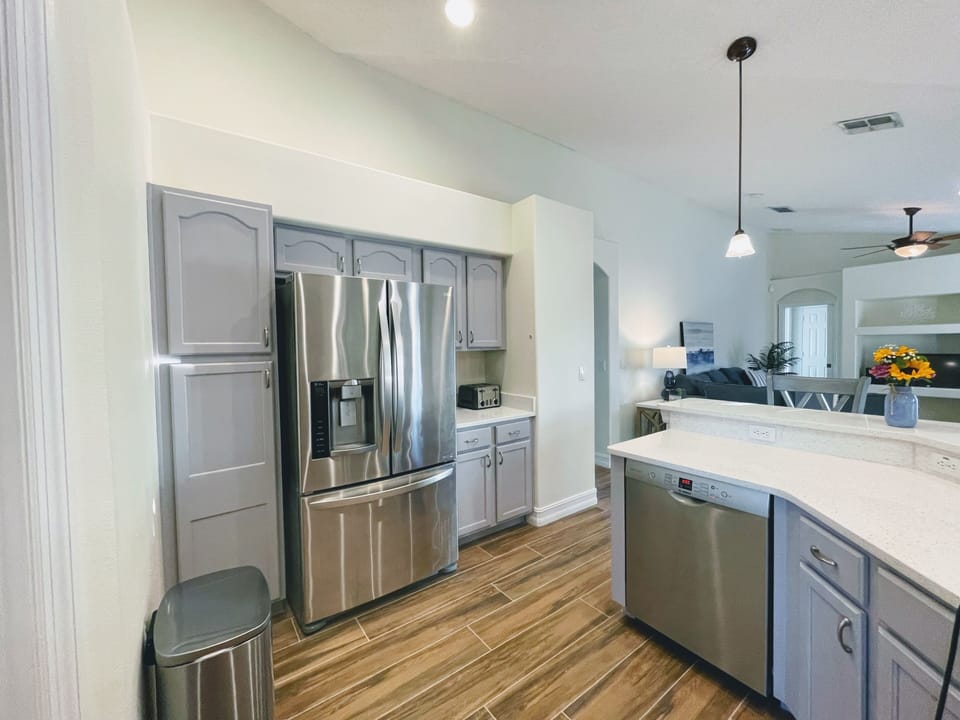 Spacious entertainer’s kitchen w/ breakfast bar and chef’s water views!
