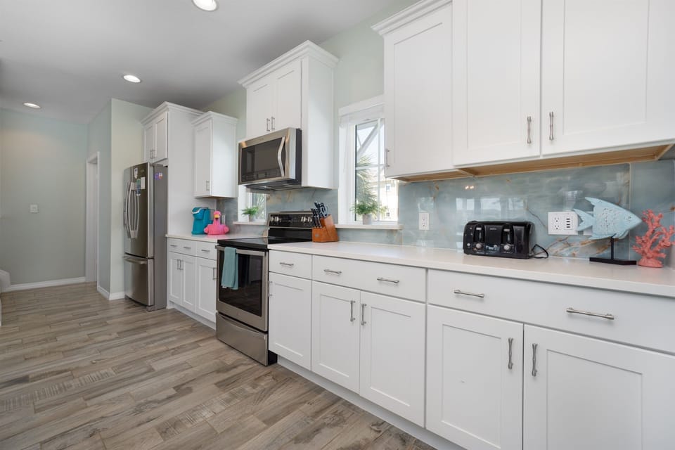 Modern kitchen with ample counter space and everything needed for home-cooked meals