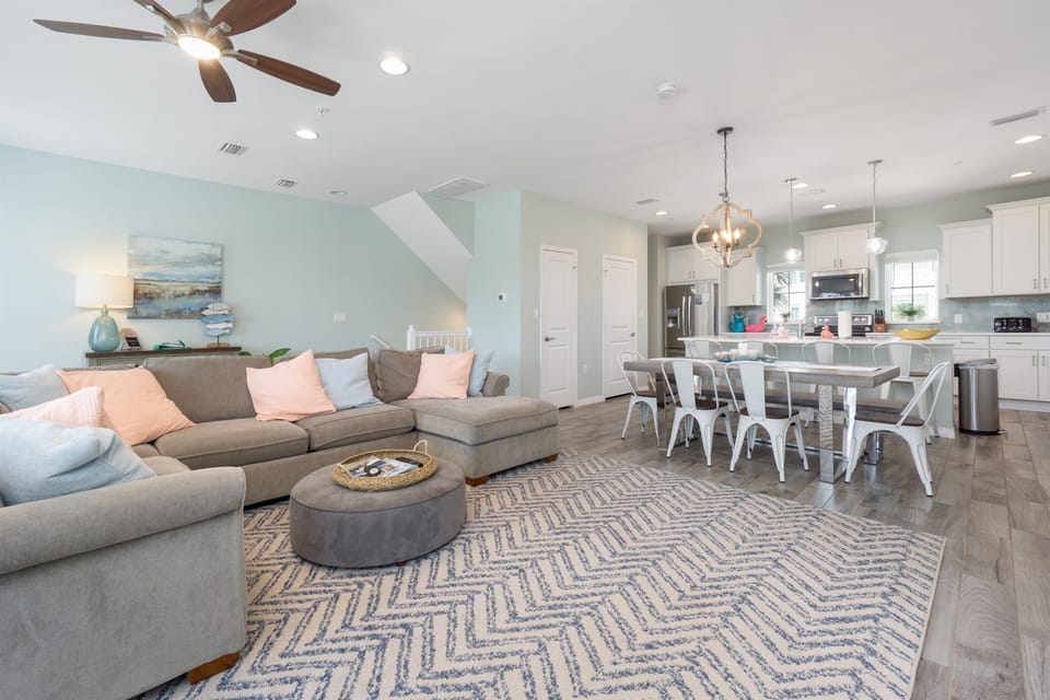 The open living area is great for family game night or unwinding after a day in the sun