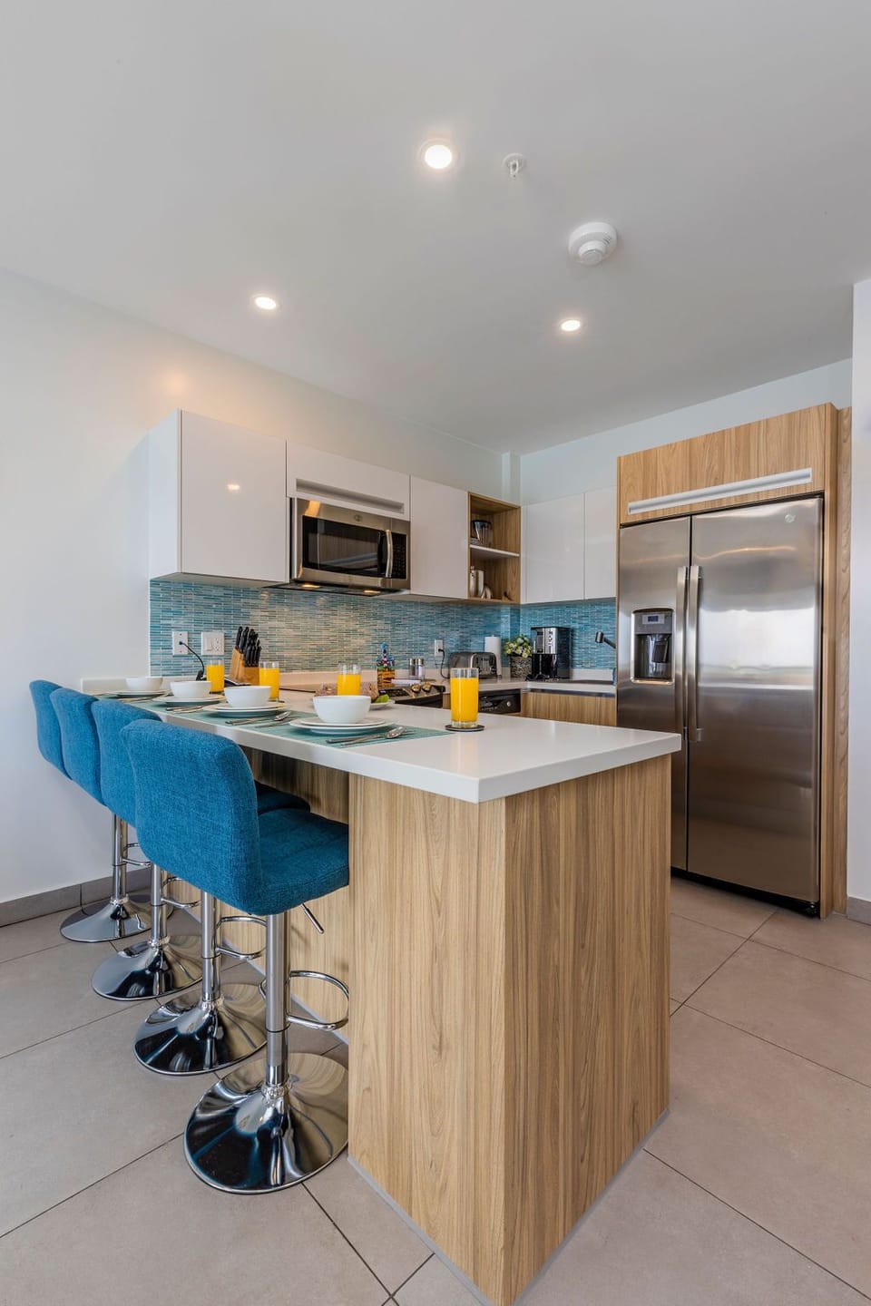 Step into your sleek, modern bathroom—freshly stocked towels, a spacious walk-in shower, and thoughtful touches await your arrival.